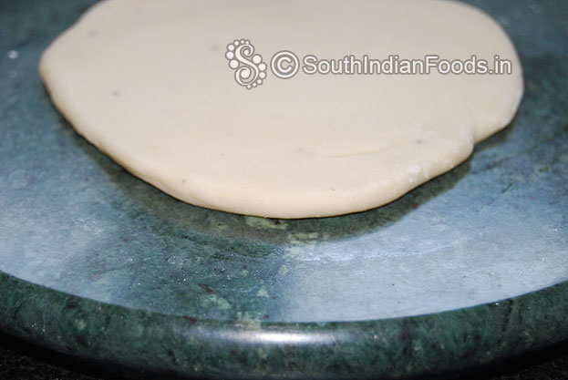 Sprinkle flour roll out into thick chapatti